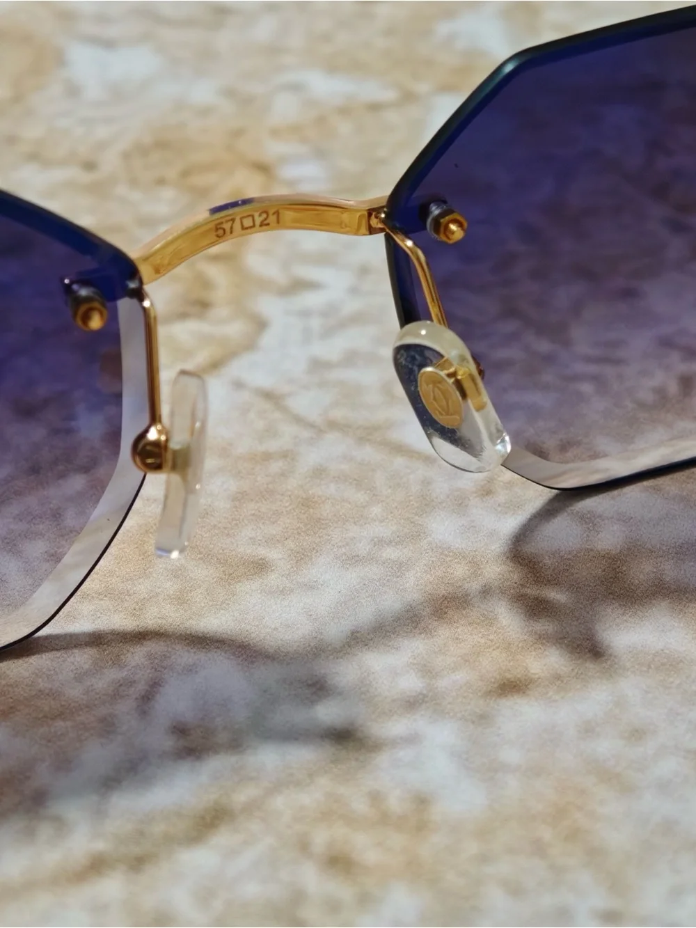 Cartier Women’s Rimless Sunglasses with Purple Gradient Lenses and Gold Accents